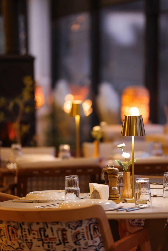 our-services-02 Elegant restaurant table setting with warm lighting, ideal for intimate dinners.